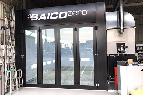Black STJ spray booth in a workshop
