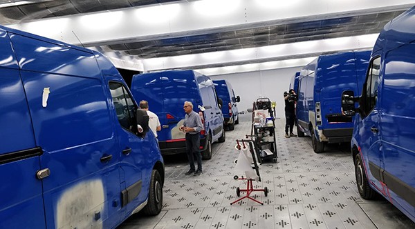 Vans in a high-production refinish area